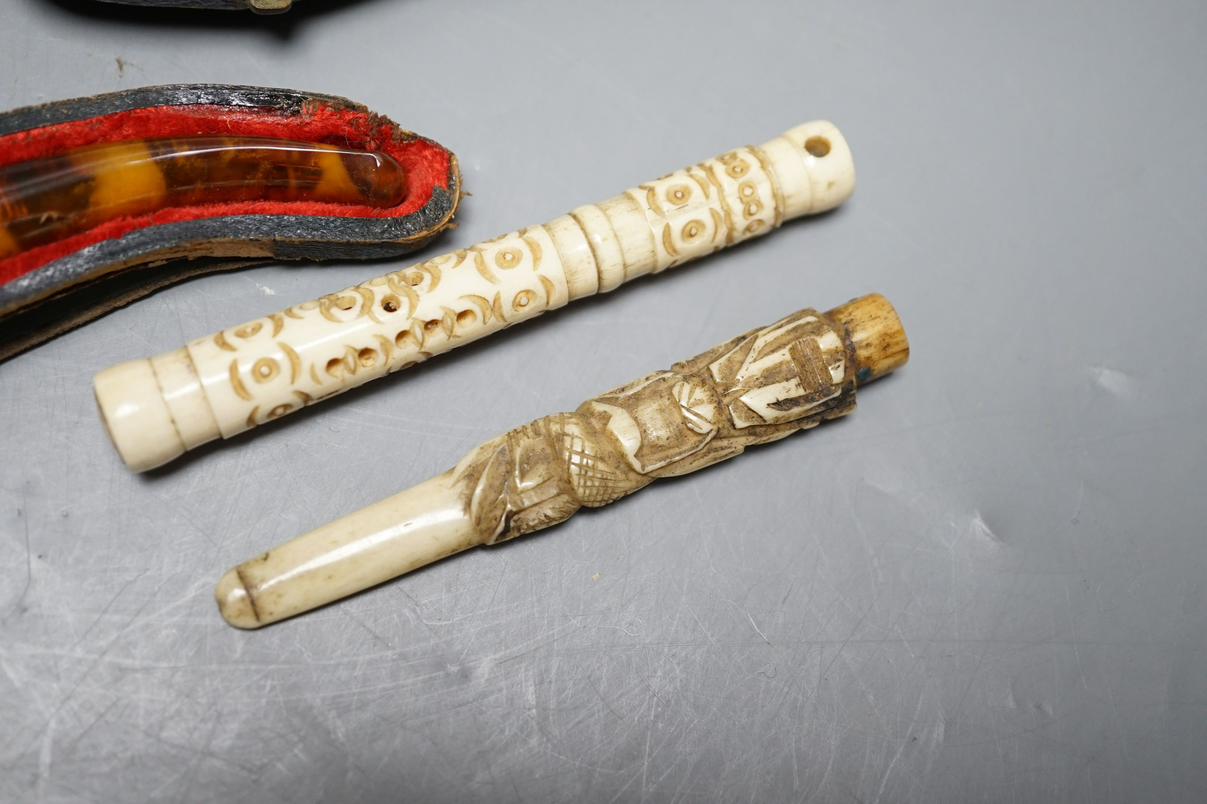 Three cased meerschaum pipes, another pipe and two bone cheroot holders